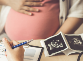 Pregnant person getting tests done in medical practice