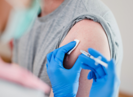 Man receiving a vaccine injection