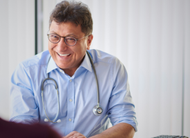 GP doctor smiling