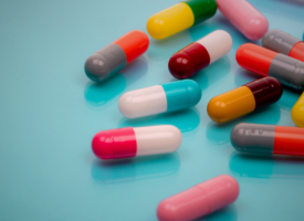 Medicine pills on blue background