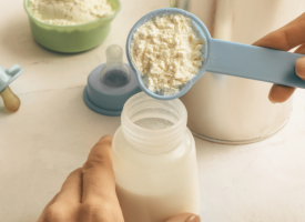 Person preparing infant formula milk