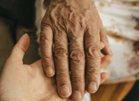 Older hand on younger hand