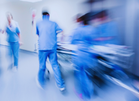 picture of doctors rushing at a hospital