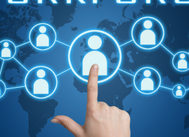 image of finger pointing at computer screen