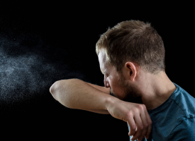 man coughing