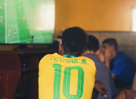 Kid watching match on TV