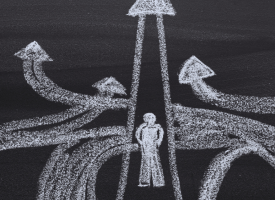 Person and pathways on blackboard