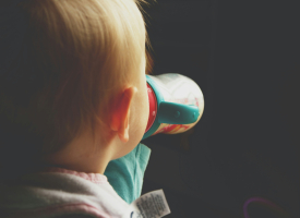 Toddler with sippy bottle
