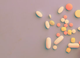 Pills scattered out of pill bottle