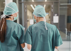 Doctors in scrubs talking