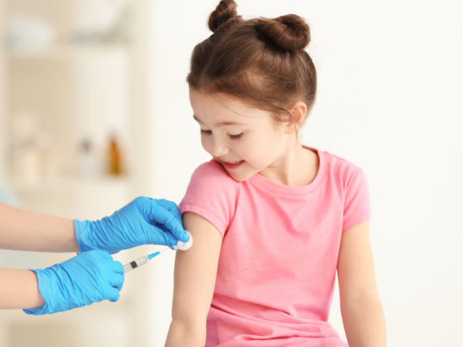 Young girl getting a vaccination