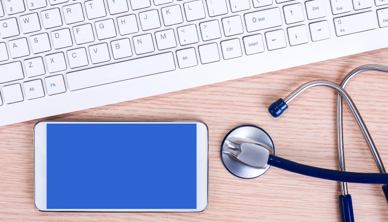 Image of laptop, mobile phone and stethoscope