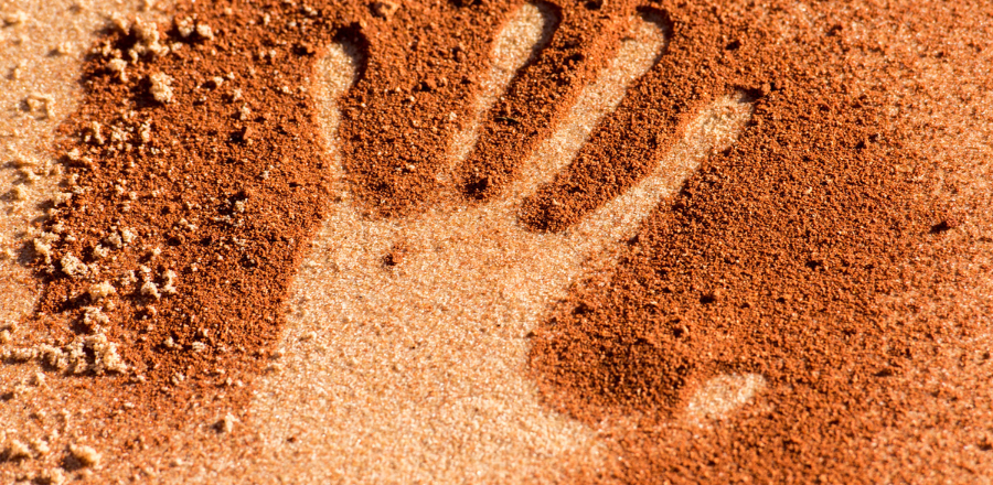 handprint in red earth 