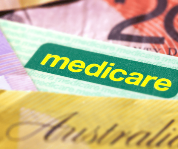 Medicare card with $50 note 