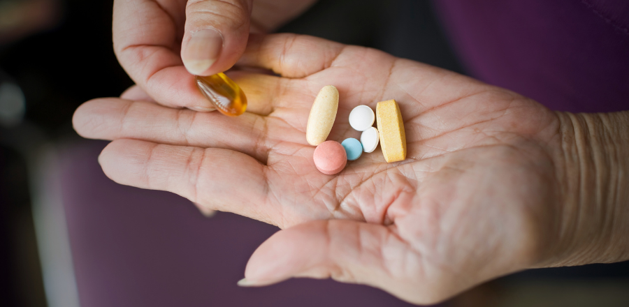 image of pills on a person's hand