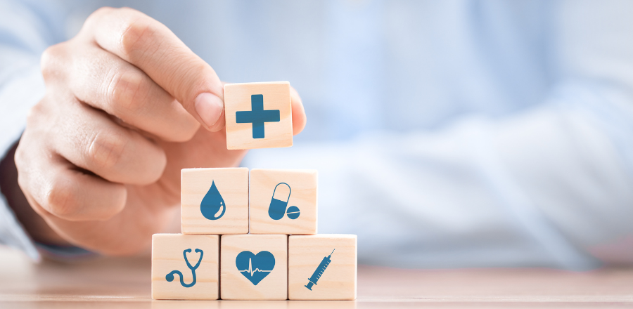 Hand arranging wood block with healthcare medical icon. Health insurance - concept