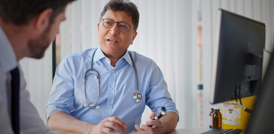 General practitioner doctor speaking with a patient