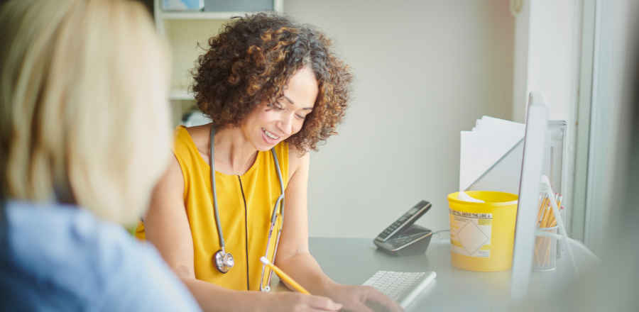 Female GP consulting with a female patient