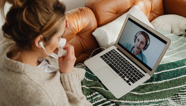 woman talking to doctor by computer