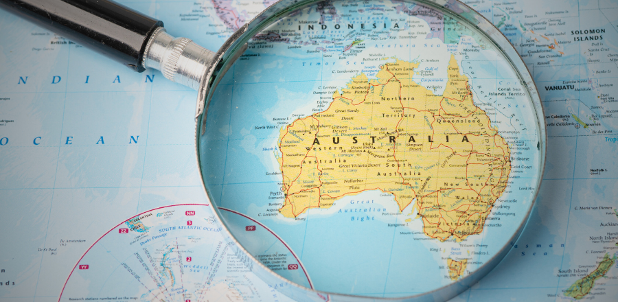 Magnifying glass over a map of Australia