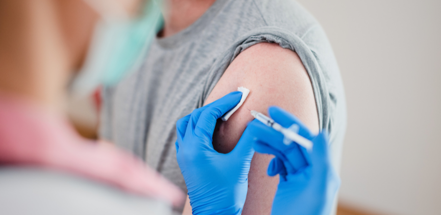 Man receiving a vaccine injection