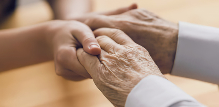 Two people holding hands